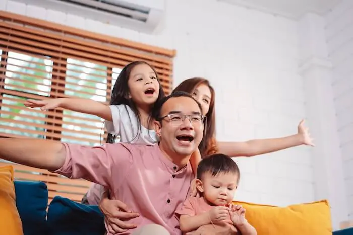 happy family in air conditioned room